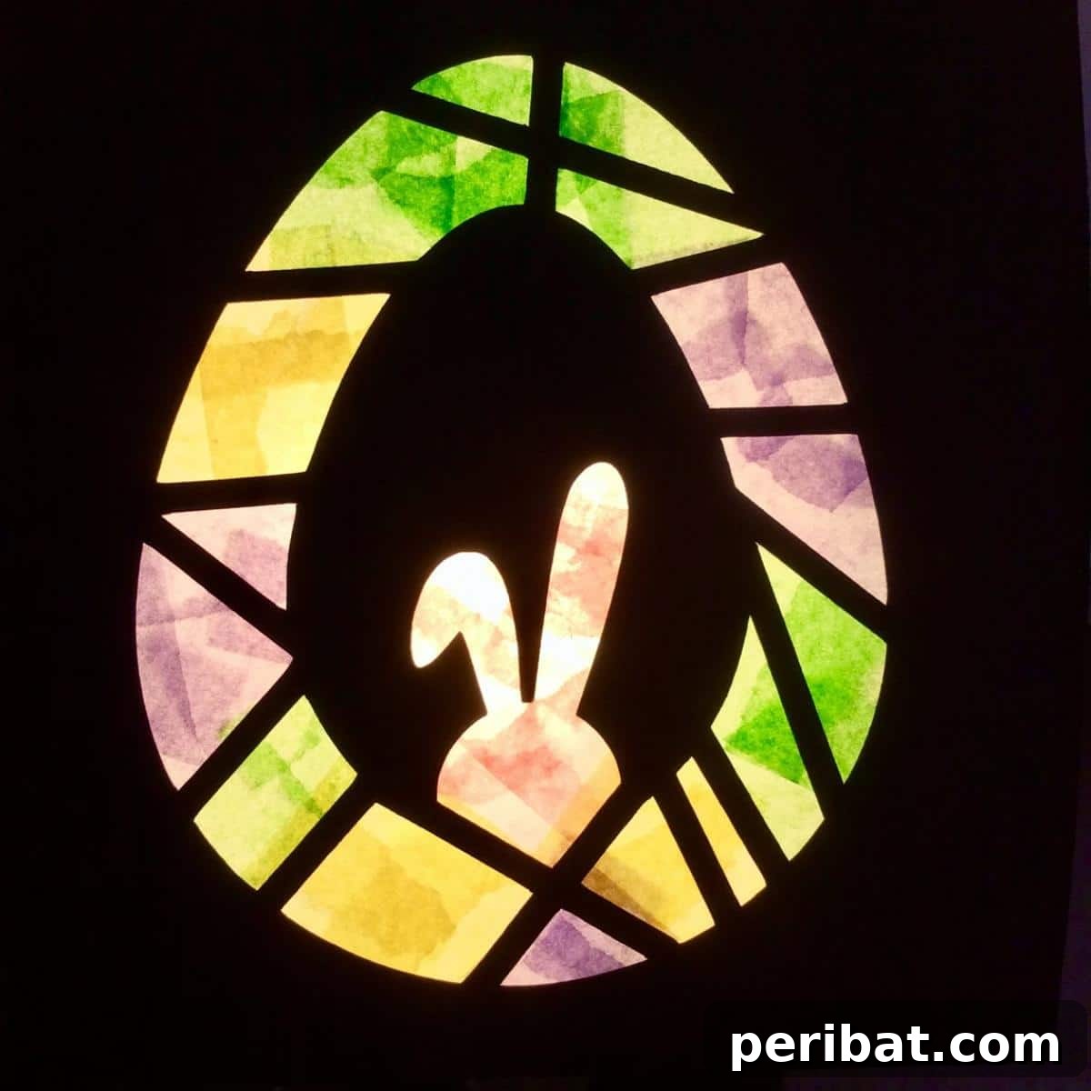 23 Vibrant DIY Tissue Paper Suncatcher Projects 24 A set of Easter-themed tissue paper stained glass decorations, including bunnies and eggs with colorful patterns.