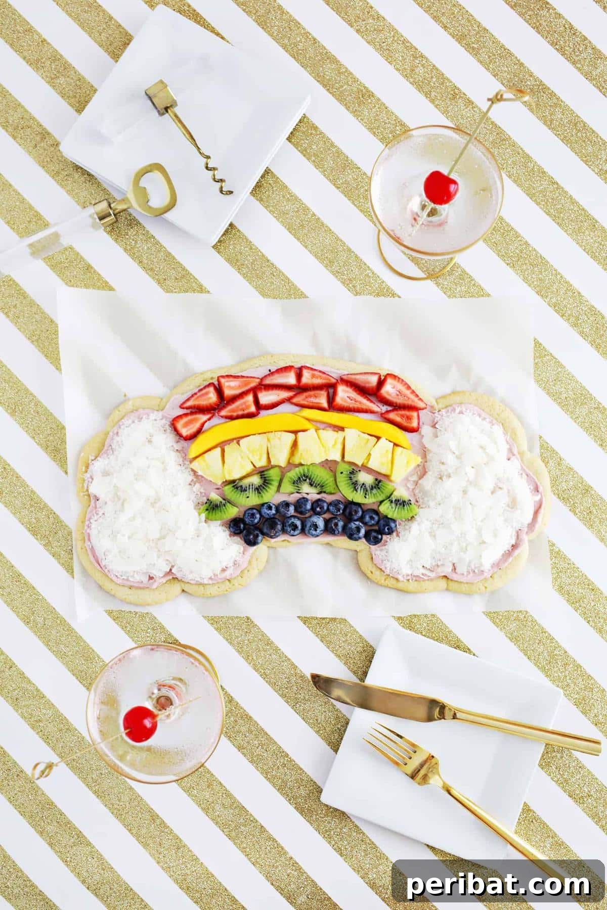 40 Brilliant Rainbow Craft Projects 11 A vibrant rainbow fruit pizza with fresh berries, kiwi, and mandarin oranges on a cookie crust