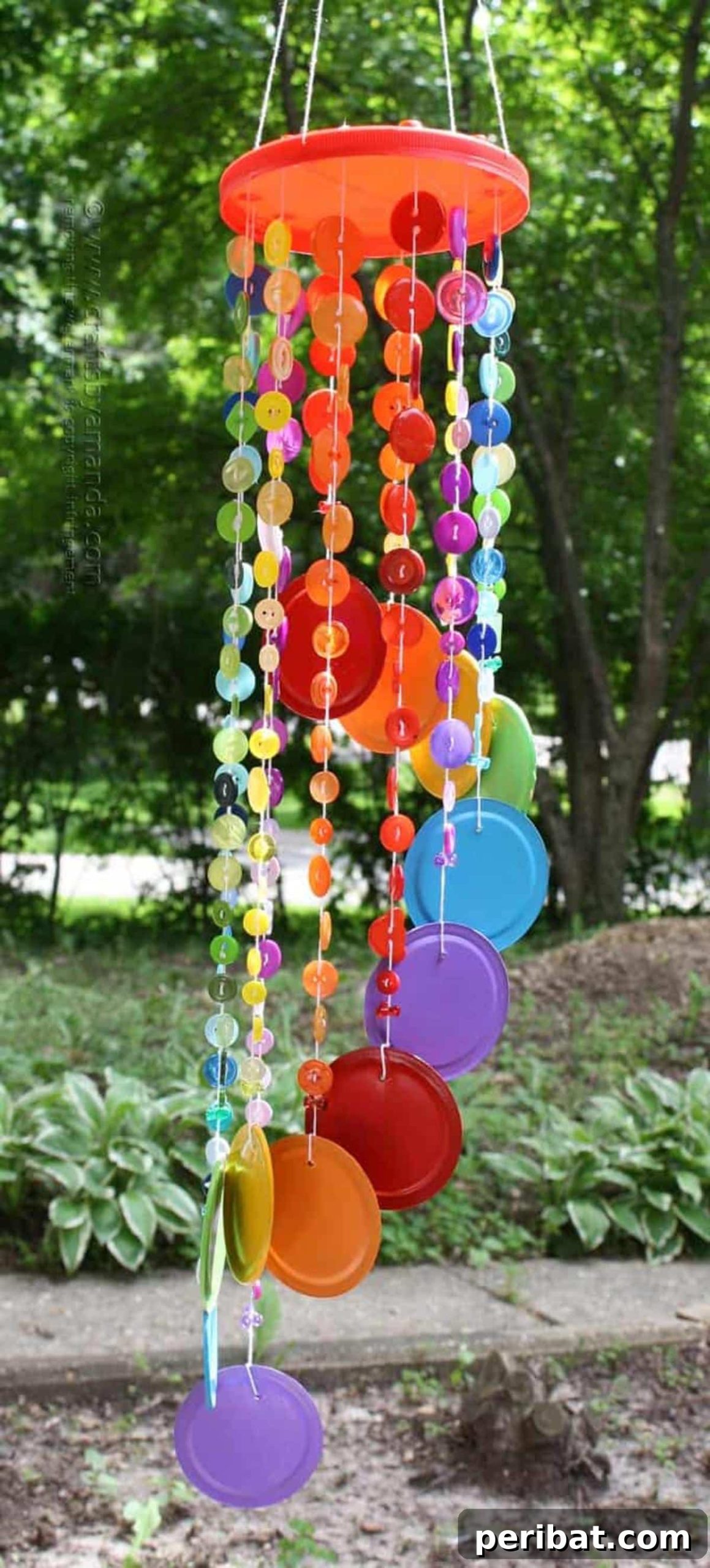40 Brilliant Rainbow Craft Projects 12 A handmade rainbow button wind chime hanging outdoors, gently swaying