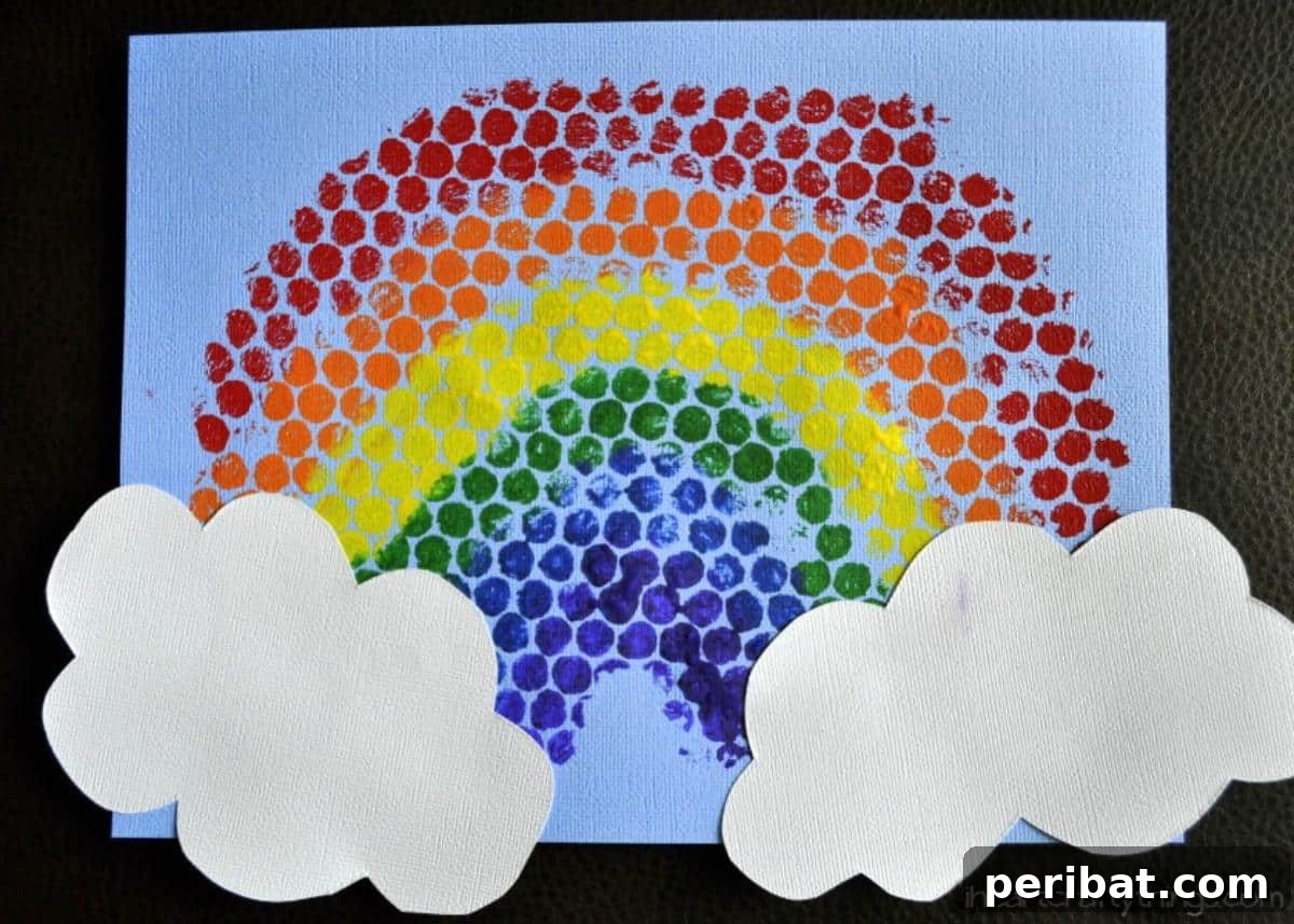 40 Brilliant Rainbow Craft Projects 15 Children's art showing bubble wrap printed rainbows on paper
