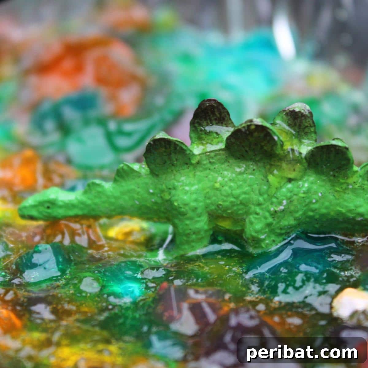 40 Brilliant Rainbow Craft Projects 16 Colorful rainbow jelly dessert with toy dinosaurs embedded for a playful effect