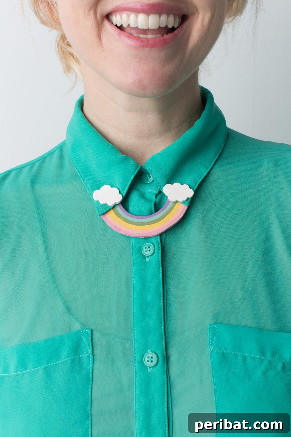 40 Brilliant Rainbow Craft Projects 27 A close-up of a stylish DIY rainbow collar pin attached to a shirt
