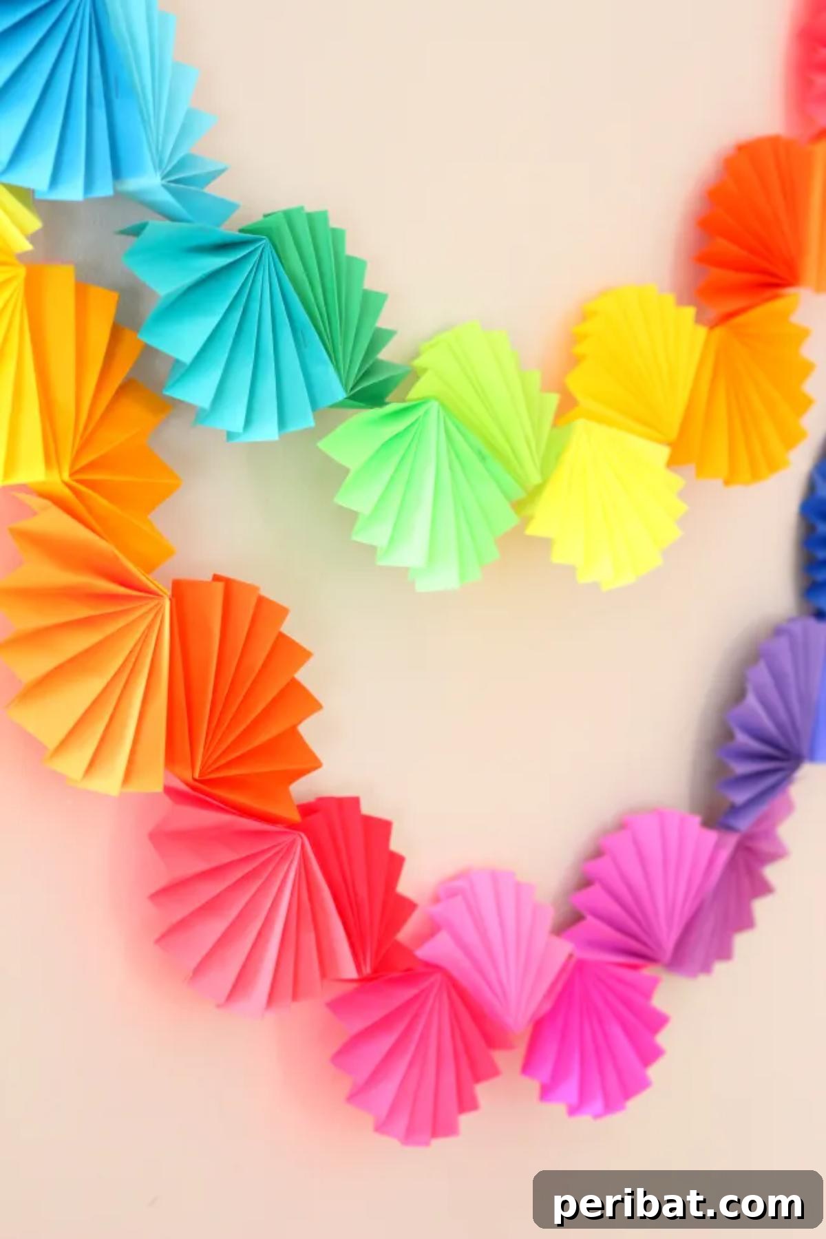 40 Brilliant Rainbow Craft Projects 29 A festive rainbow fan garland hanging as party decoration