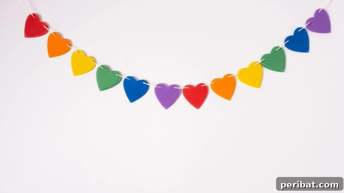 40 Brilliant Rainbow Craft Projects 34 A festive DIY rainbow heart banner hanging, perfect for Valentine's Day decor
