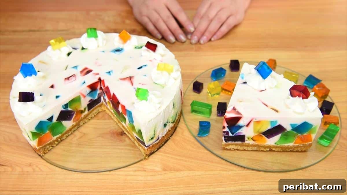40 Brilliant Rainbow Craft Projects 5 A slice of colorful rainbow jello cake with distinct layers on a white plate