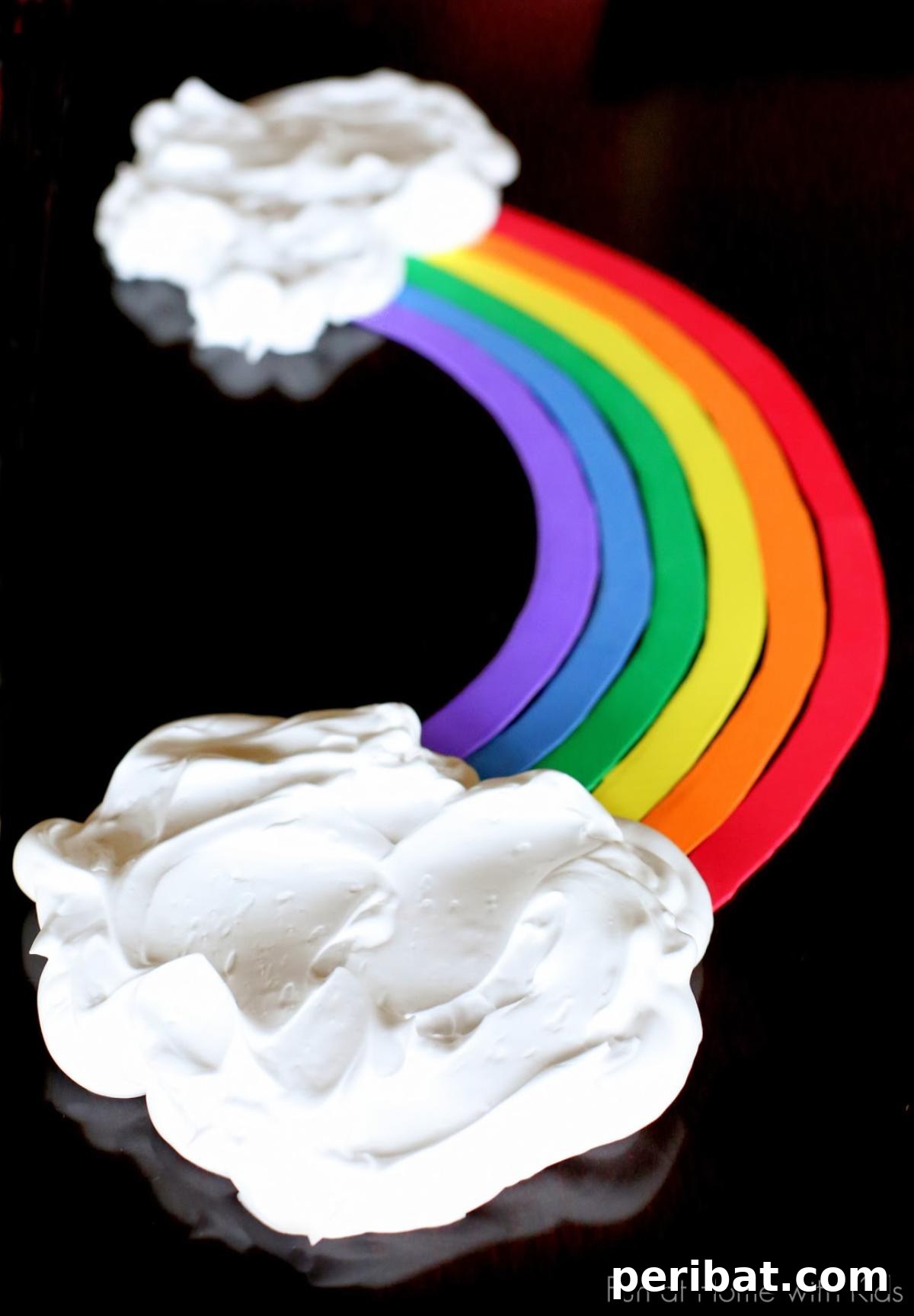 40 Brilliant Rainbow Craft Projects 10 Toddler playing with various colorful sensory items like pom-poms and feathers in a tray
