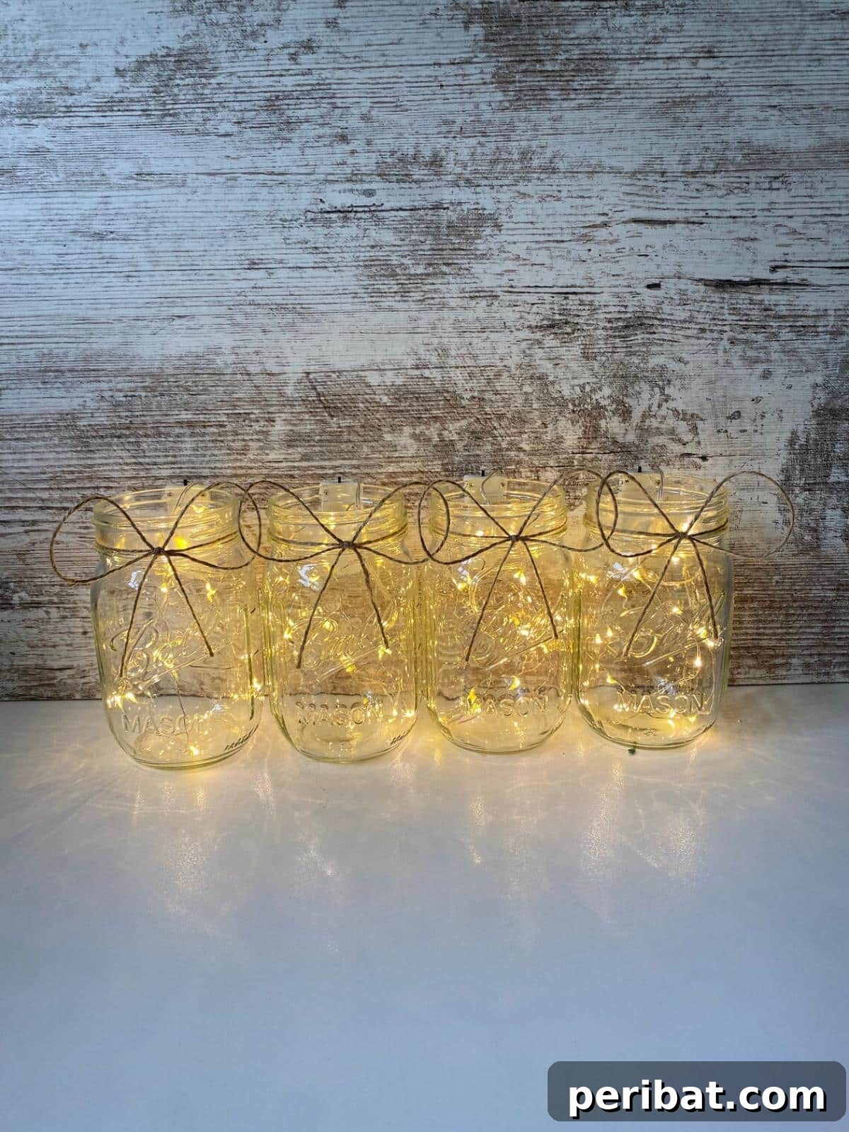 Mason Jar Magic: 20 DIY Tissue Paper Lanterns 19 A simple yet elegant mason jar filled with warm fairy lights, customizable for any occasion.