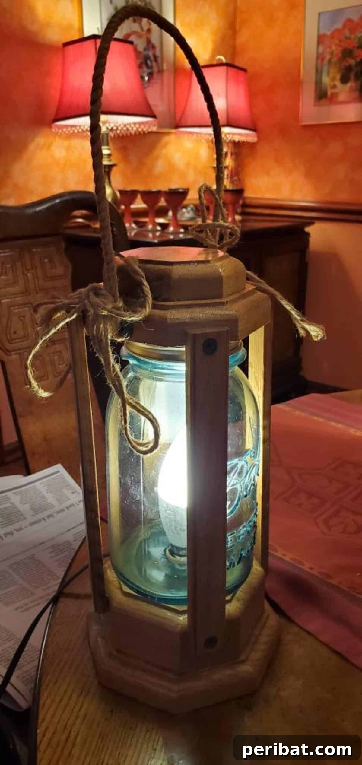 Mason Jar Magic: 20 DIY Tissue Paper Lanterns 21 A mounted Ball Perfect Mason jar lantern encased in pine, featuring a color-changing LED bulb.