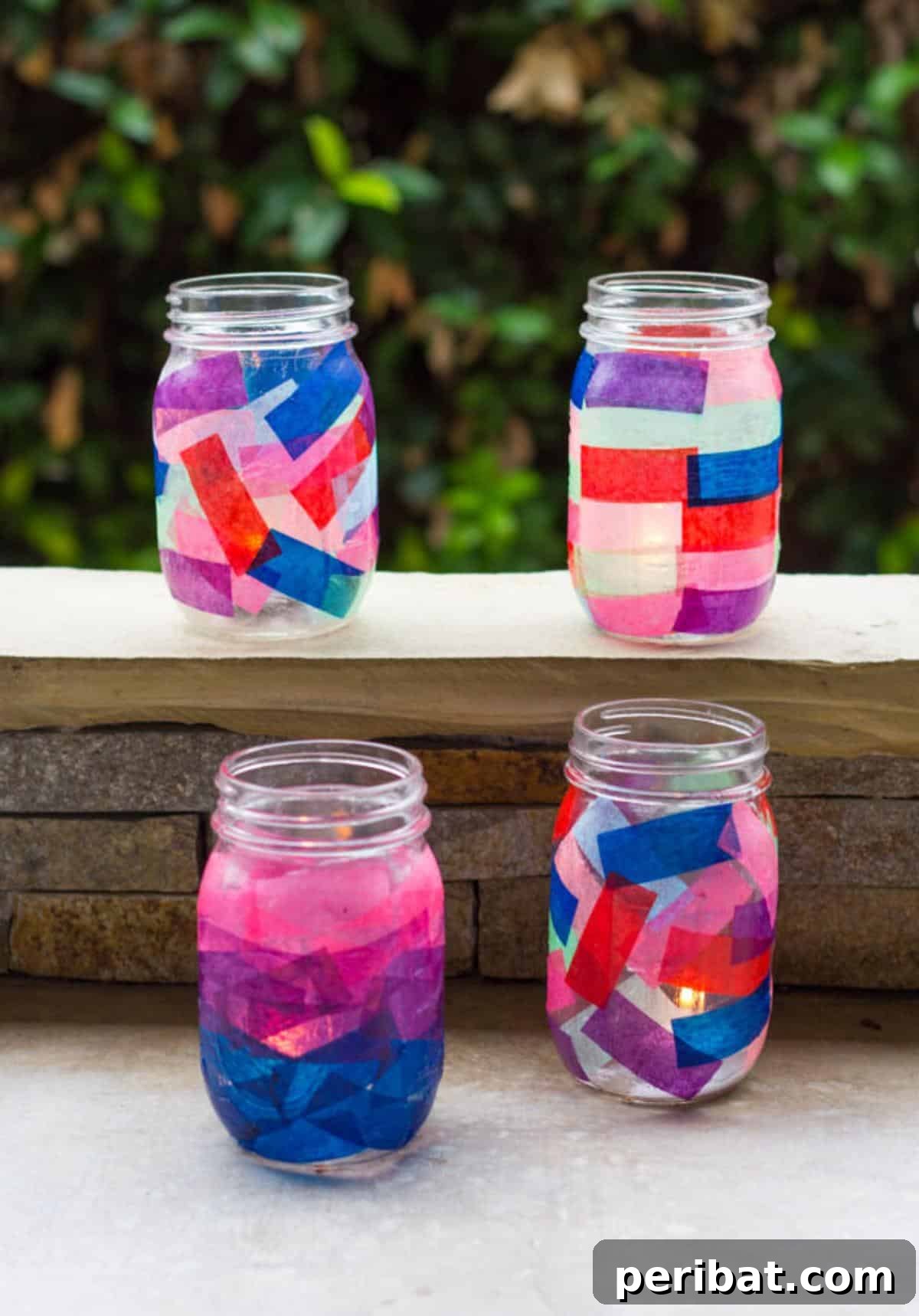 Mason Jar Magic: 20 DIY Tissue Paper Lanterns 5 A collection of beautifully decorated tissue paper mason jar lanterns with various patterns and colors.