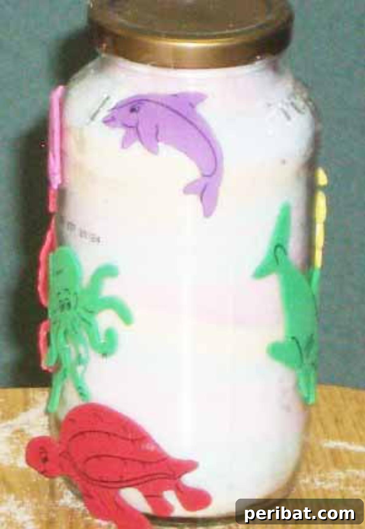 Crafting Colorful Salt Jars 25 Project Ideas 12 An inspiring ocean-themed colored salt art jar, featuring shades of blue and green layered salt, reminiscent of ocean depths. Perfect for educational purposes or as calming home decor.