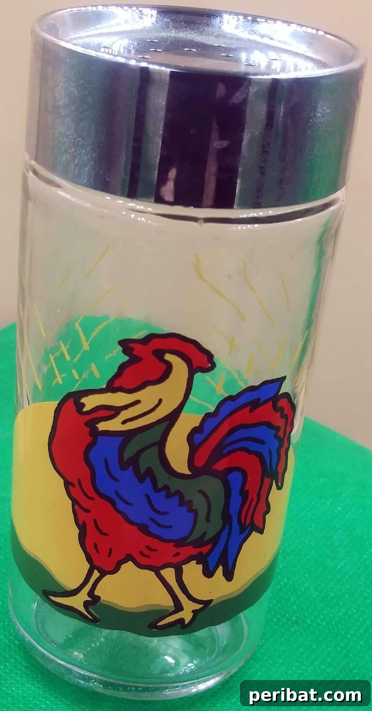 Crafting Colorful Salt Jars 25 Project Ideas 25 A unique tall round glass rooster salt shaker, featuring an artistic rooster design and a colorful, layered salt interior. This decorative and functional piece adds rustic charm to any dining setting.