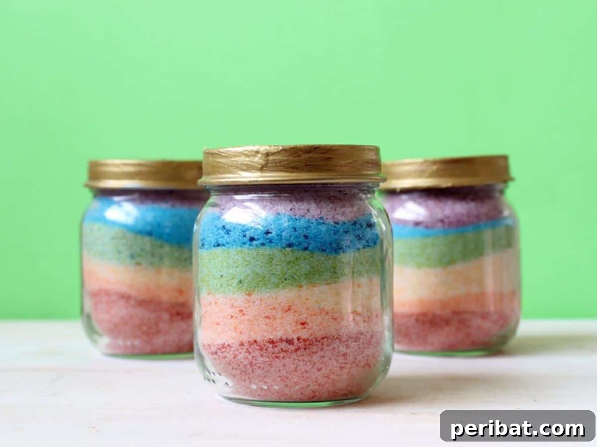 Crafting Colorful Salt Jars 25 Project Ideas 6 A charming Pot O’ Gold Rainbow Salt Art piece with a gold lid, showcasing vibrant layered salt in a small jar. This festive craft is ideal for St. Patrick's Day celebrations or as a lucky charm.