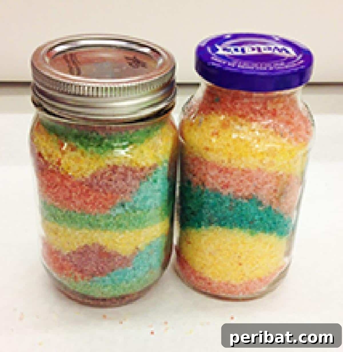 Crafting Colorful Salt Jars 25 Project Ideas 7 A collection of DIY colorful salt jars, featuring various sized glass containers filled with brightly layered salts. These jars are functional art, perfect for decor or educational tools for children.