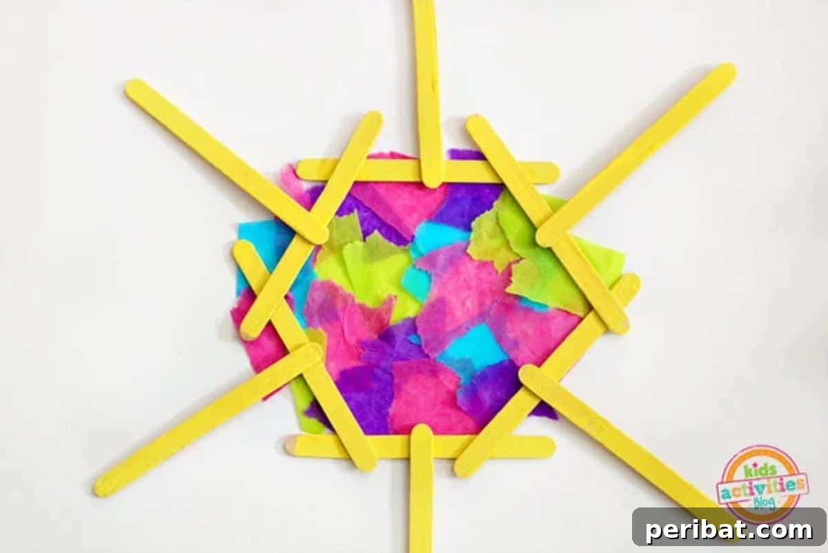 Popsicle Stick & Tissue Paper Mosaic Sun Craft for kids.