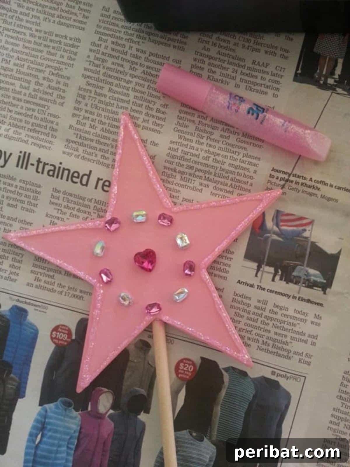 A sparkling Star Fairy Wand, adorned with pink paint and glitter glue.