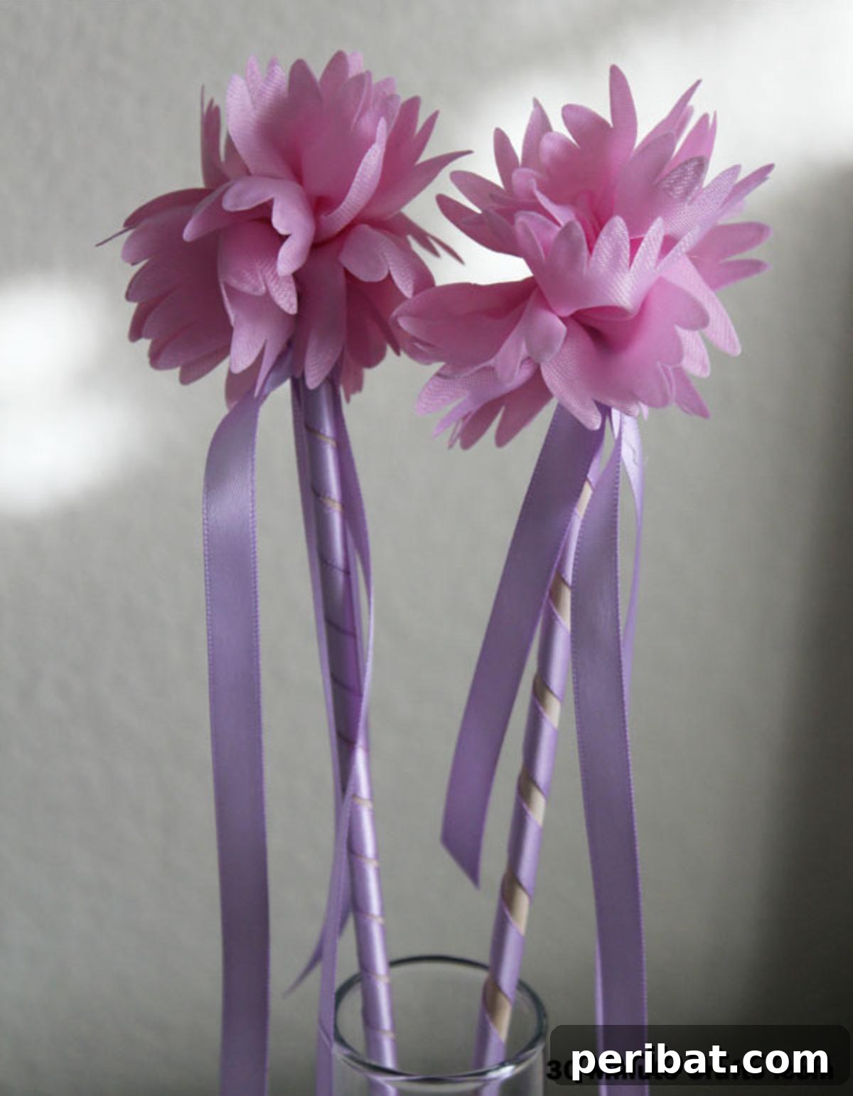 Quick and easy 10-minute Fairy Princess Wands with colorful pom-poms.