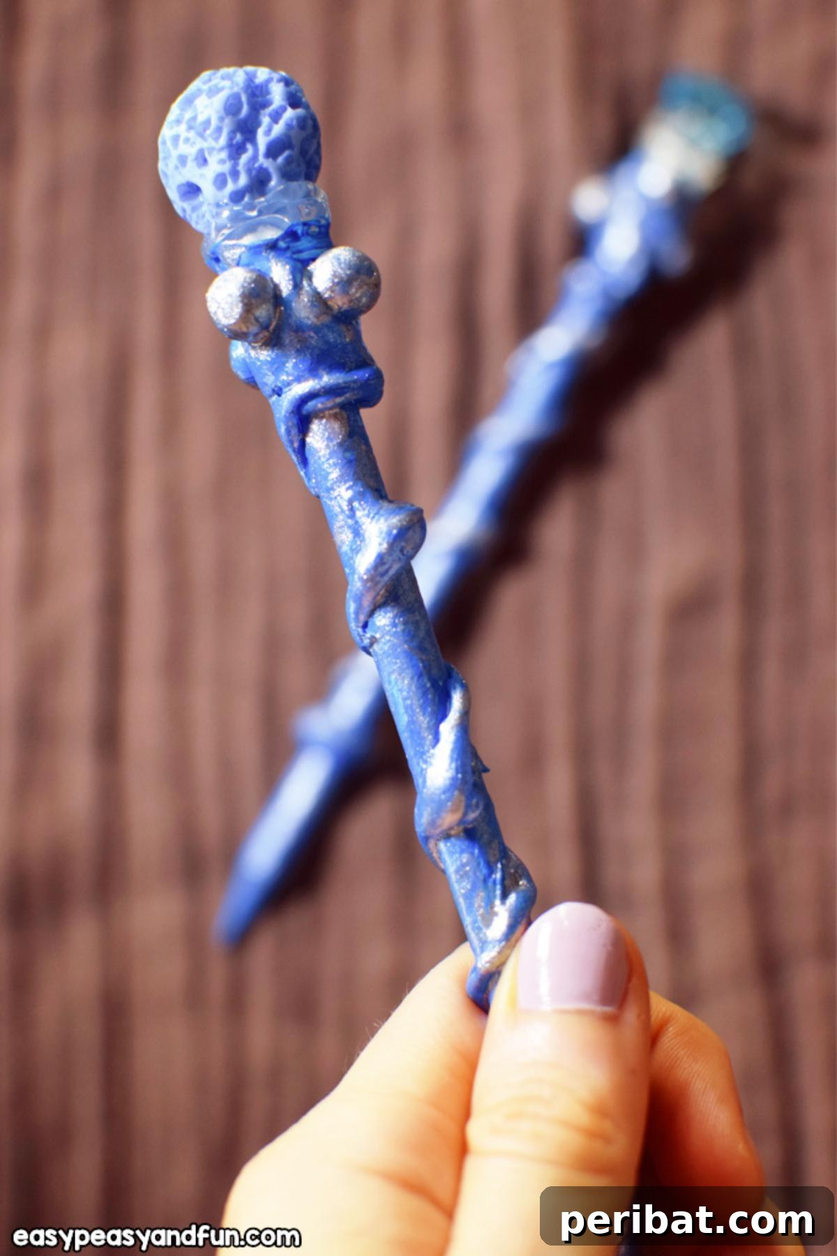 A collection of vibrant DIY Magical Wands, decorated with beads and paint.
