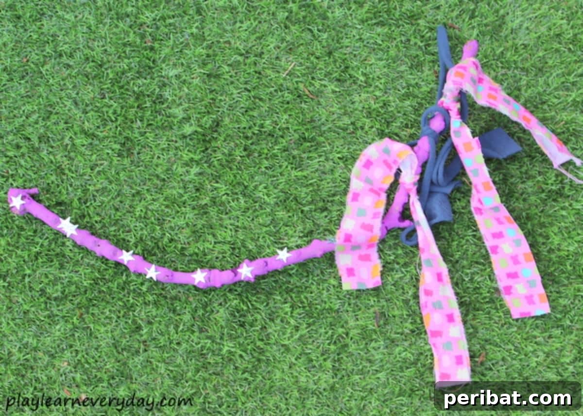 Colorful Fabric Fairy Wand with ribbons and a natural stick handle.