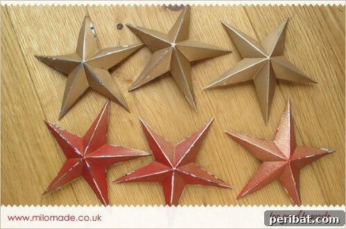 Beyond the Bin Brilliant Soda Can Projects 19 Rustic decorative stars cut from textured soda cans, arranged on a surface