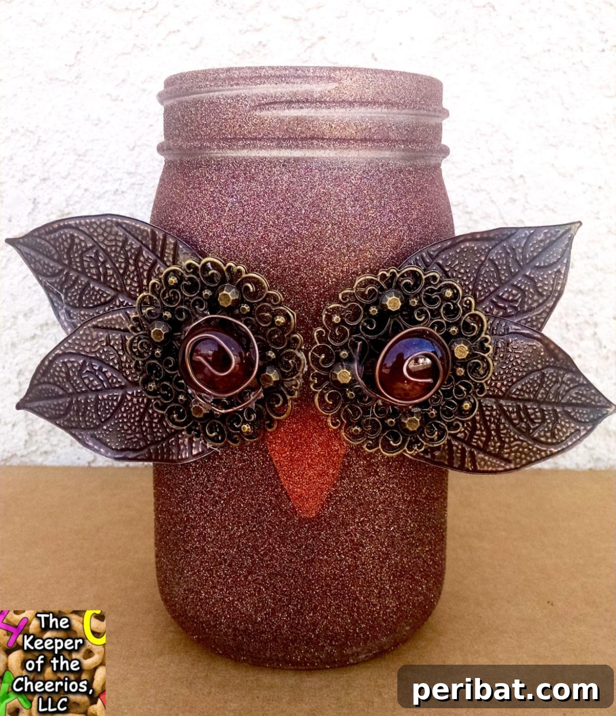 Charming fall owl mason jar, adorned with autumn-inspired features.