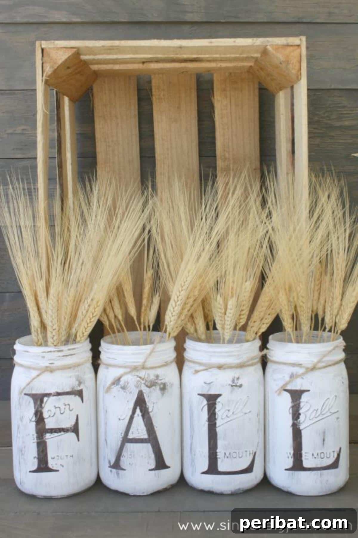 Charming fall rustic mason jars, adorned with burlap and natural embellishments.