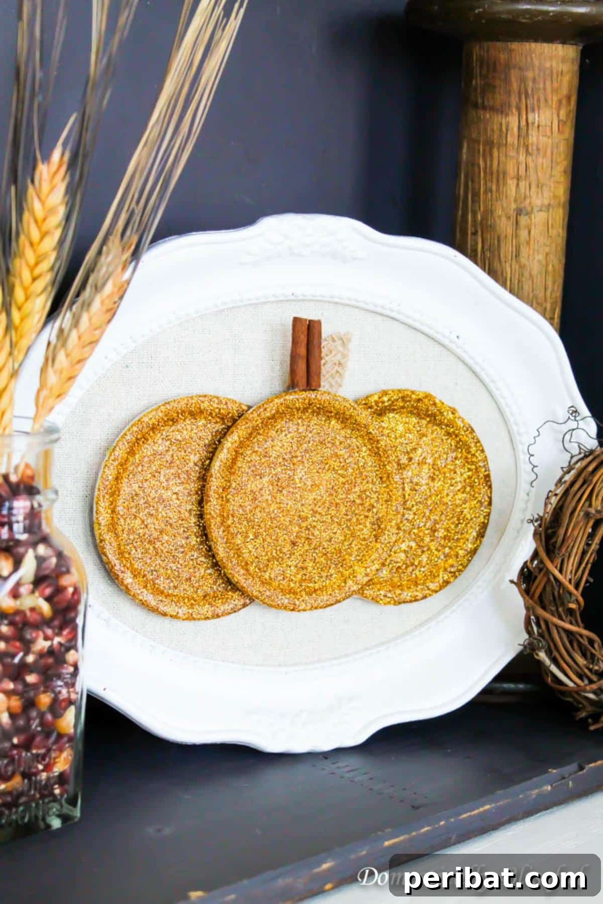 Glamorous sparkling gold mason jar lid pumpkin, adding elegance to fall decor.