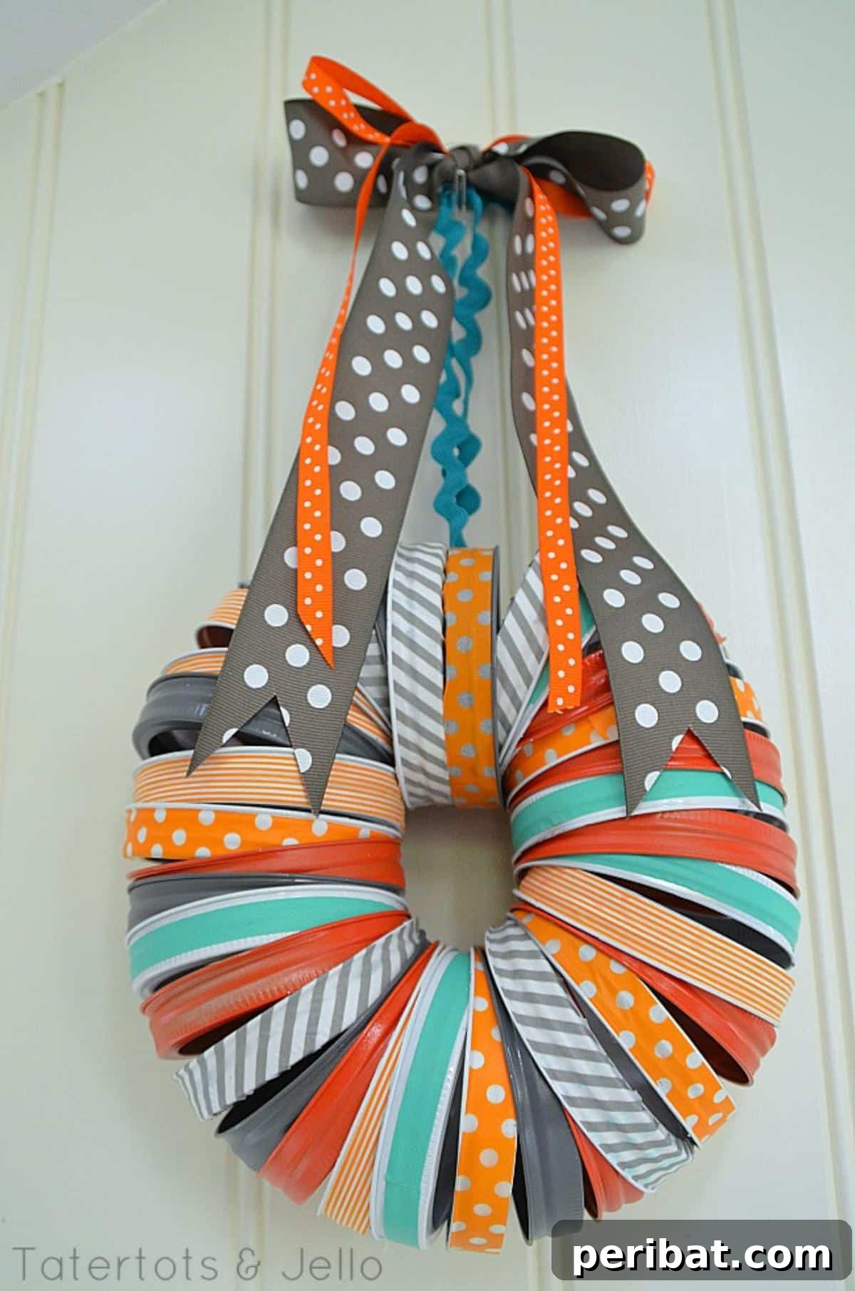 Festive Halloween mason jar lid wreath, painted in holiday colors.