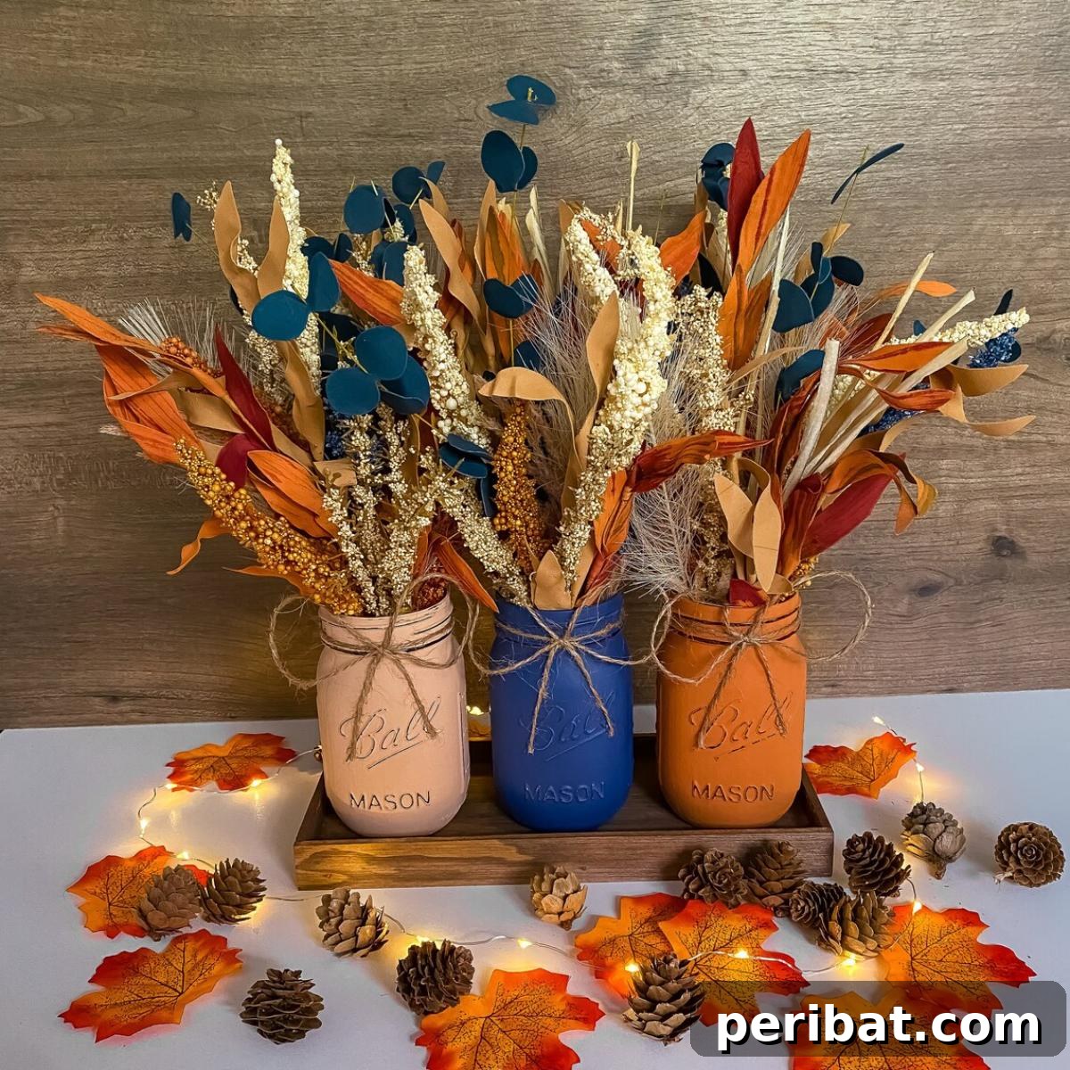 Inviting farmhouse mason jar autumn table centerpiece, featuring warm fall colors.