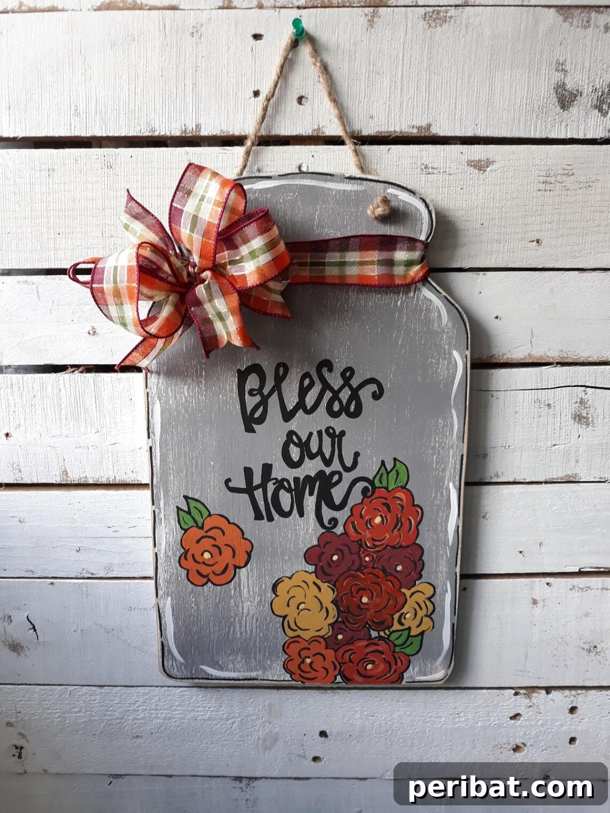 Heartwarming 'Bless Our Home' wood welcome sign and 'Life Is Sweet' mason jar, enhancing home decor.