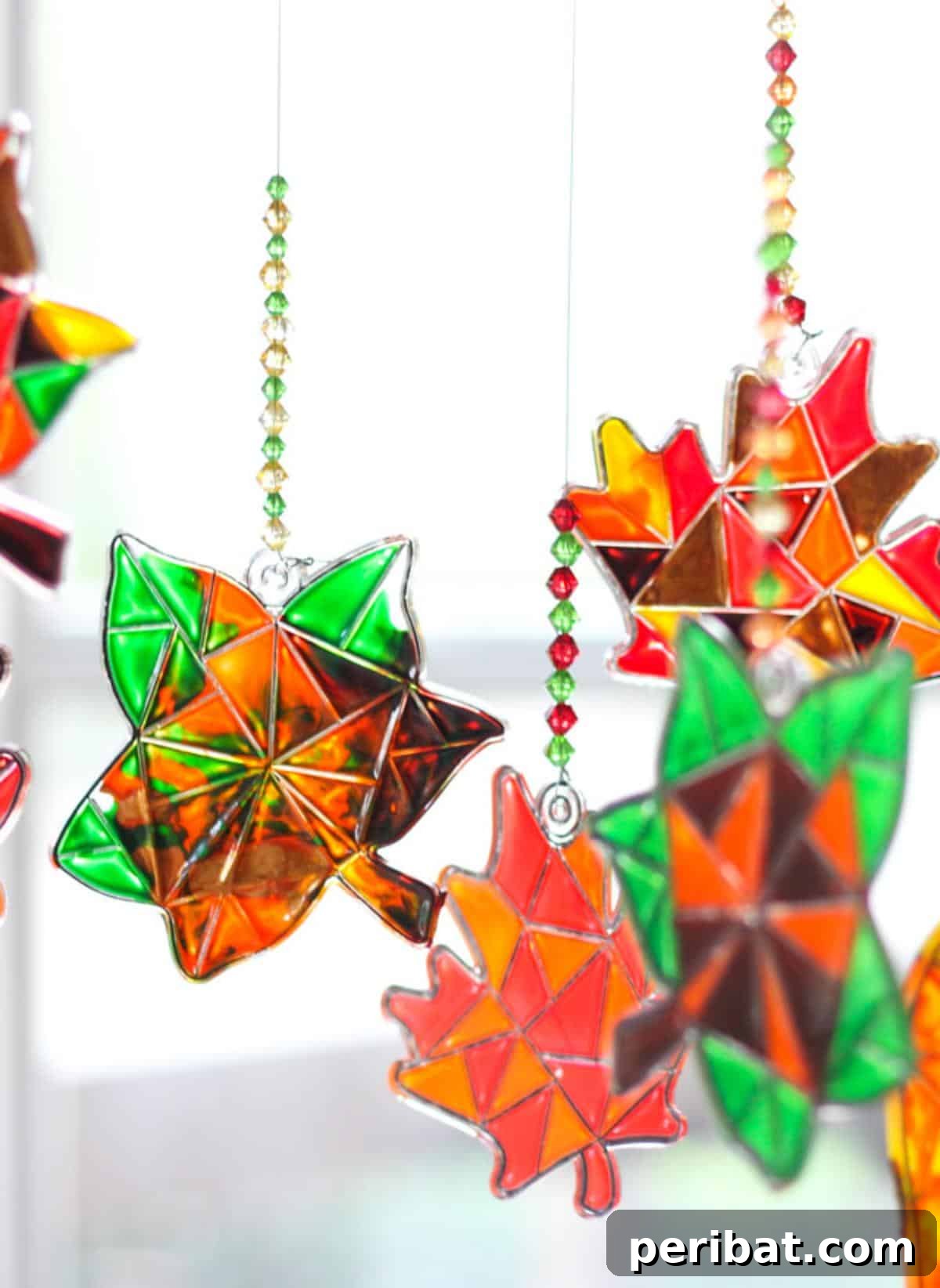 25 Sparkling Leaf Suncatcher Ideas for Fall 20 Fall Leaf Suncatcher Mobile