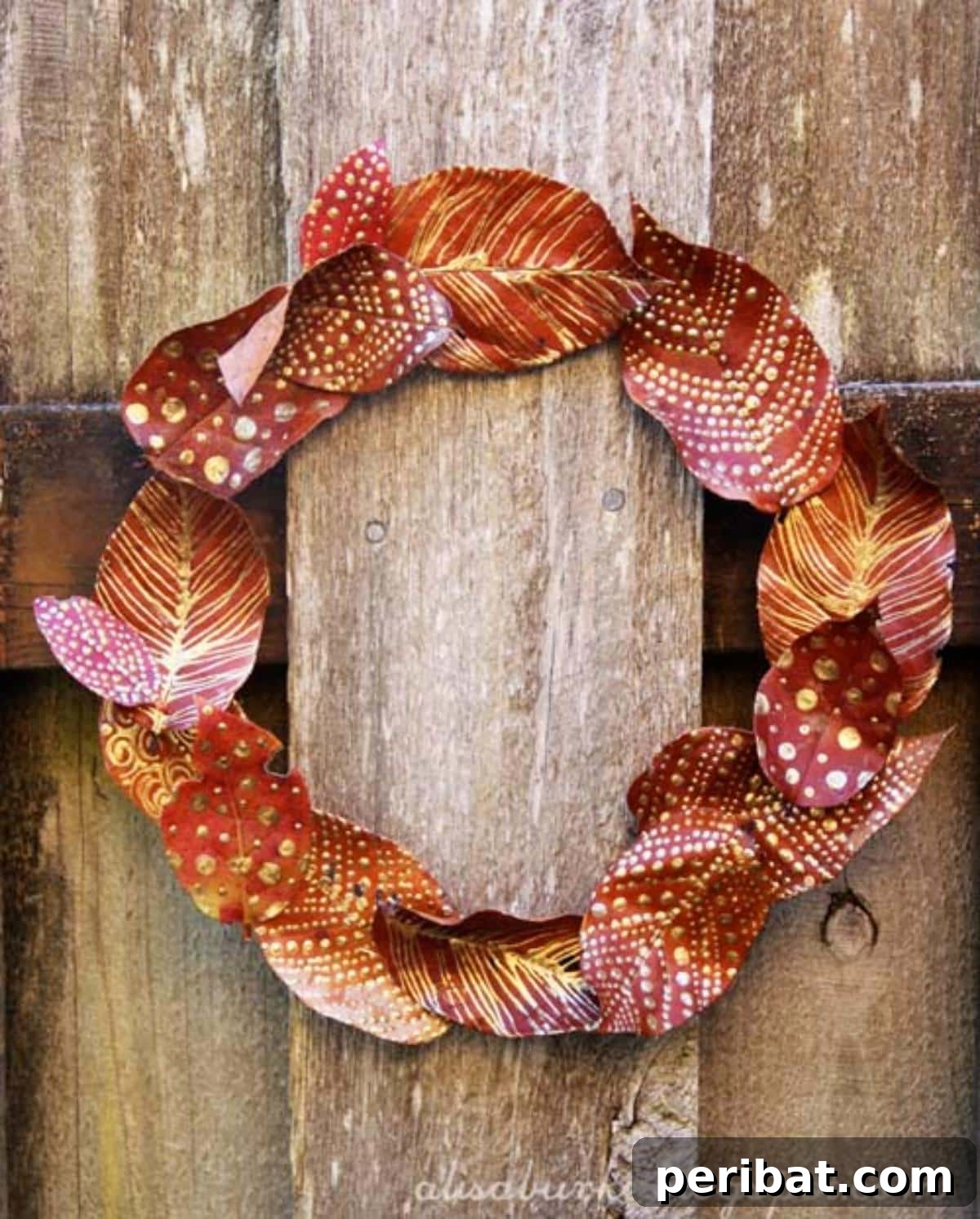 A festive and colorful fall leaves wreath, perfect for seasonal home decoration.