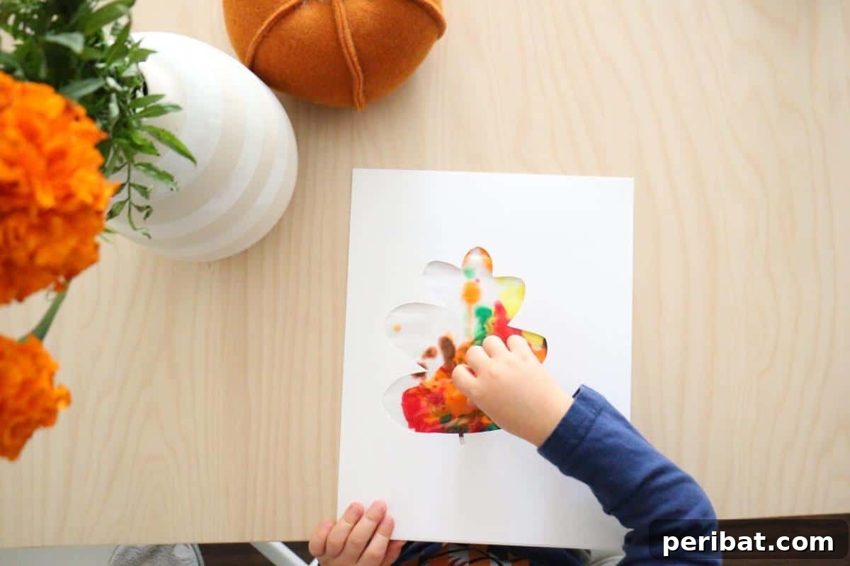 A mess-free sensory leaf painting activity in a sealed bag, perfect for young children.