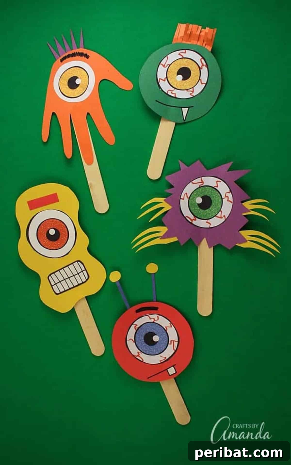 Spooktacular Popsicle Stick Halloween Projects 17 A group of colorful and quirky monsters made from popsicle sticks, each with unique googly eyes and painted designs.