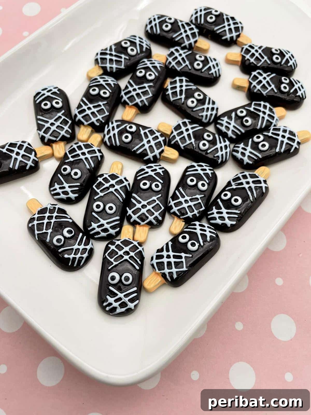 Spooktacular Popsicle Stick Halloween Projects 29 A set of black Kawaii-style zombie monster popsicle-shaped cabochons, featuring cute yet spooky designs.
