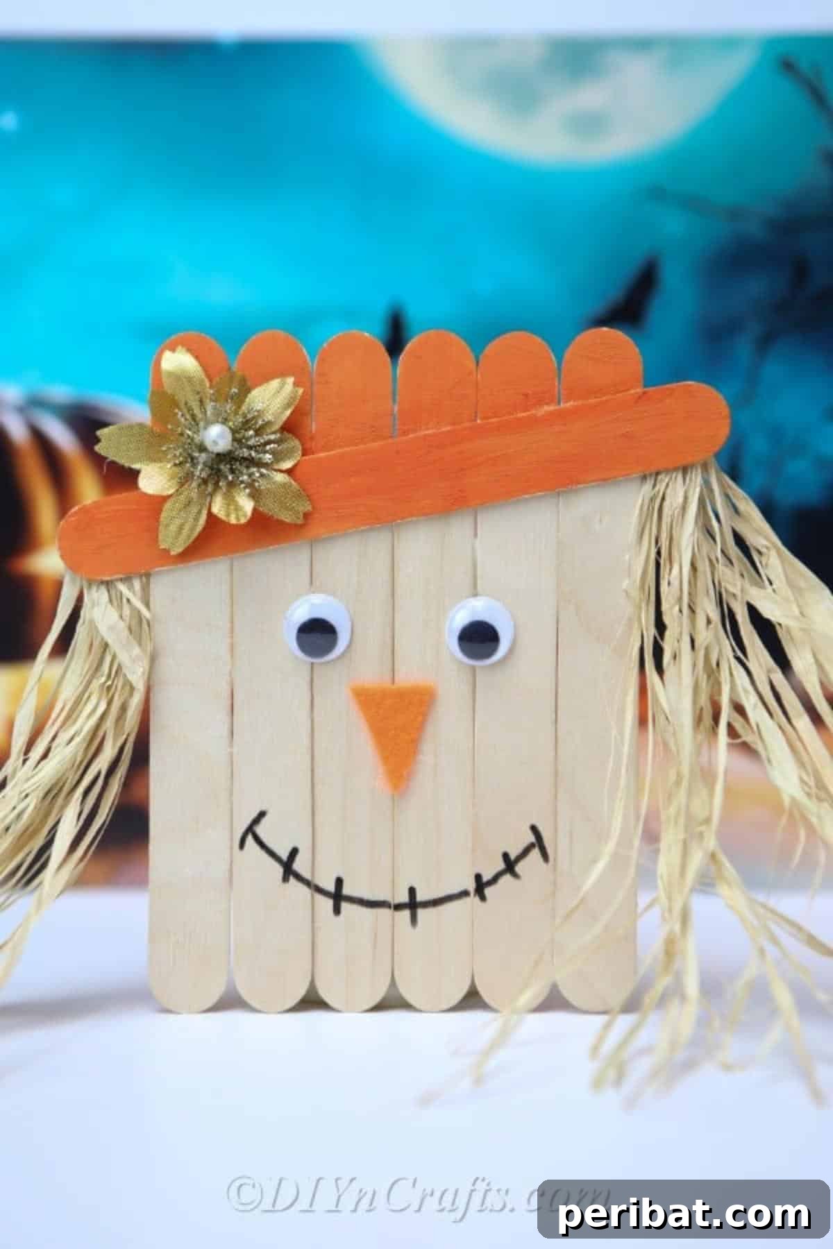 Spooktacular Popsicle Stick Halloween Projects 4 A friendly scarecrow figure made from popsicle sticks, complete with a straw hat and painted details.