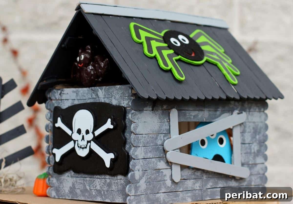 Spooktacular Popsicle Stick Halloween Projects 9 A detailed popsicle stick haunted house with a dark, eerie aesthetic, featuring intricate roof and window designs.