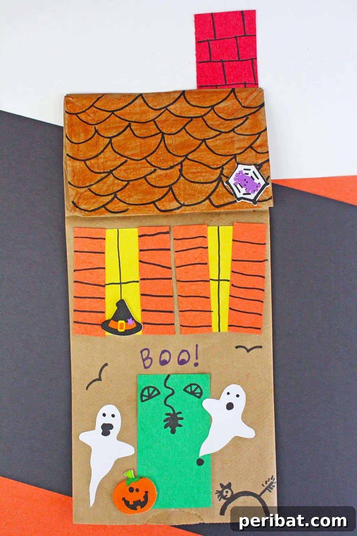 26 Autumnal Paper Bag Crafting Gems 11 A spooky yet fun paper bag haunted house craft, ideal for Halloween decorations.