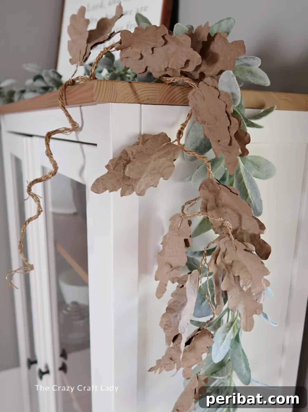 26 Autumnal Paper Bag Crafting Gems 17 A rustic and eco-friendly brown paper bag leaves garland, ideal for fall home decor.