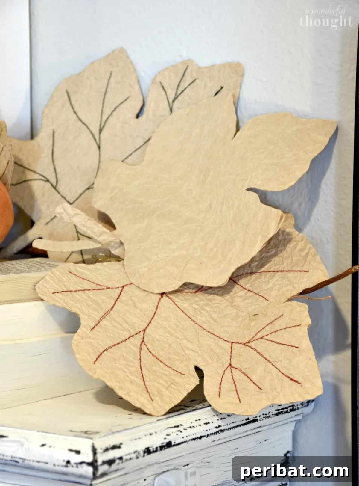 26 Autumnal Paper Bag Crafting Gems 18 A beautiful DIY fall leaf paper bag garland, showcasing intricately detailed leaves.