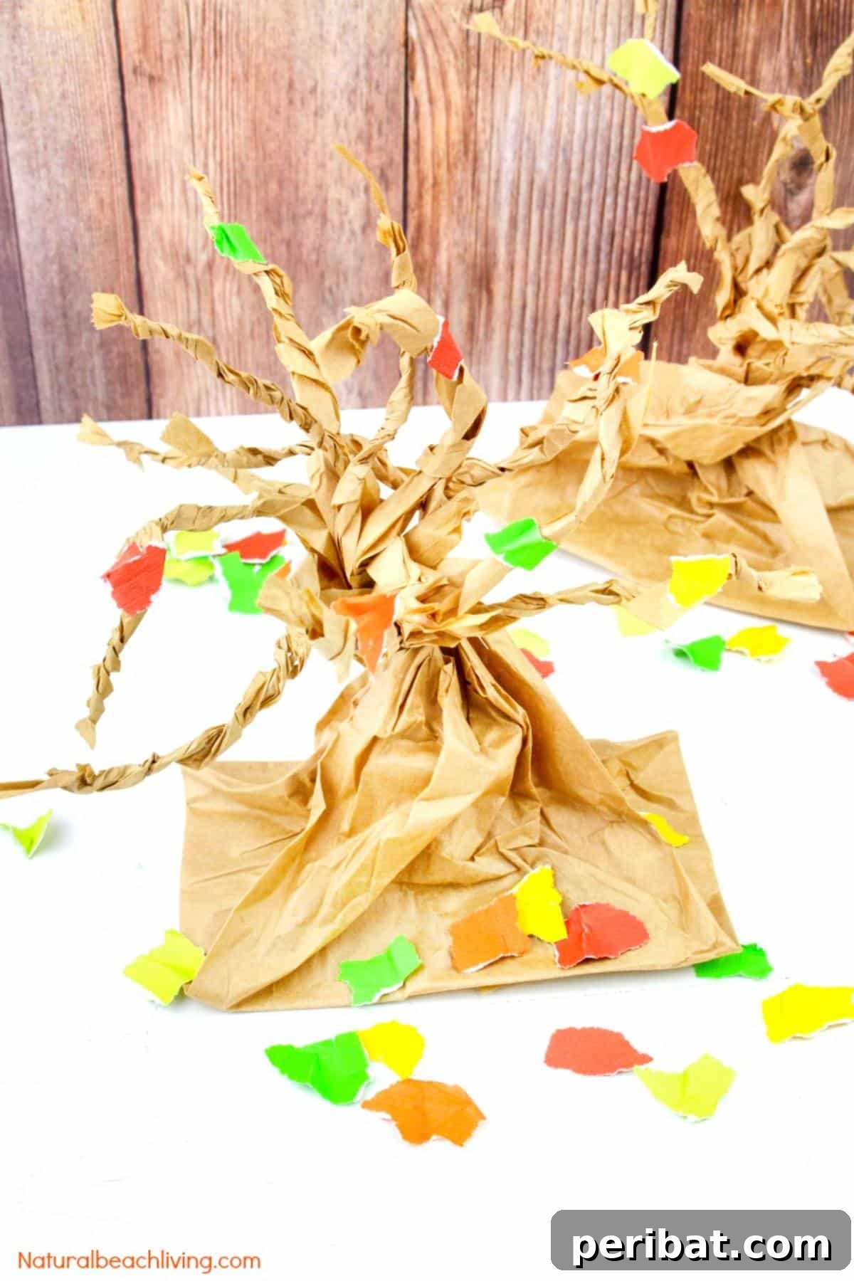 26 Autumnal Paper Bag Crafting Gems 8 A vibrant fall tree crafted from a paper bag, showcasing colorful leaves.