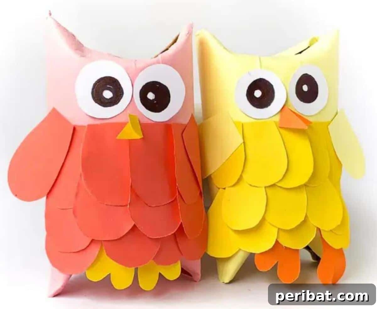 Toilet Paper Roll Owls, decorated with colorful patterns and feathers.