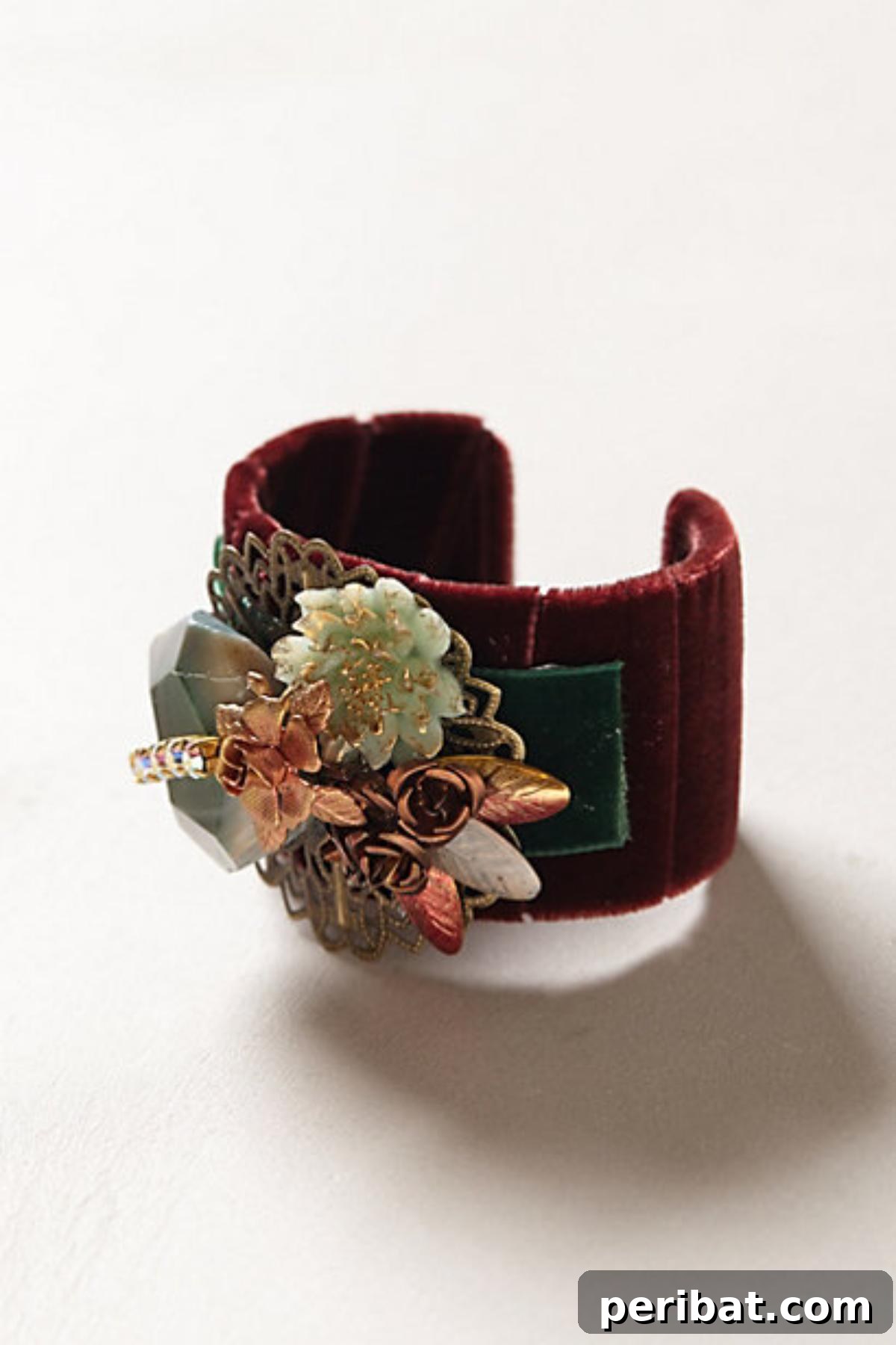 DIY Anthro-Inspired Cuff made from a toilet paper roll, decorated with fabric.