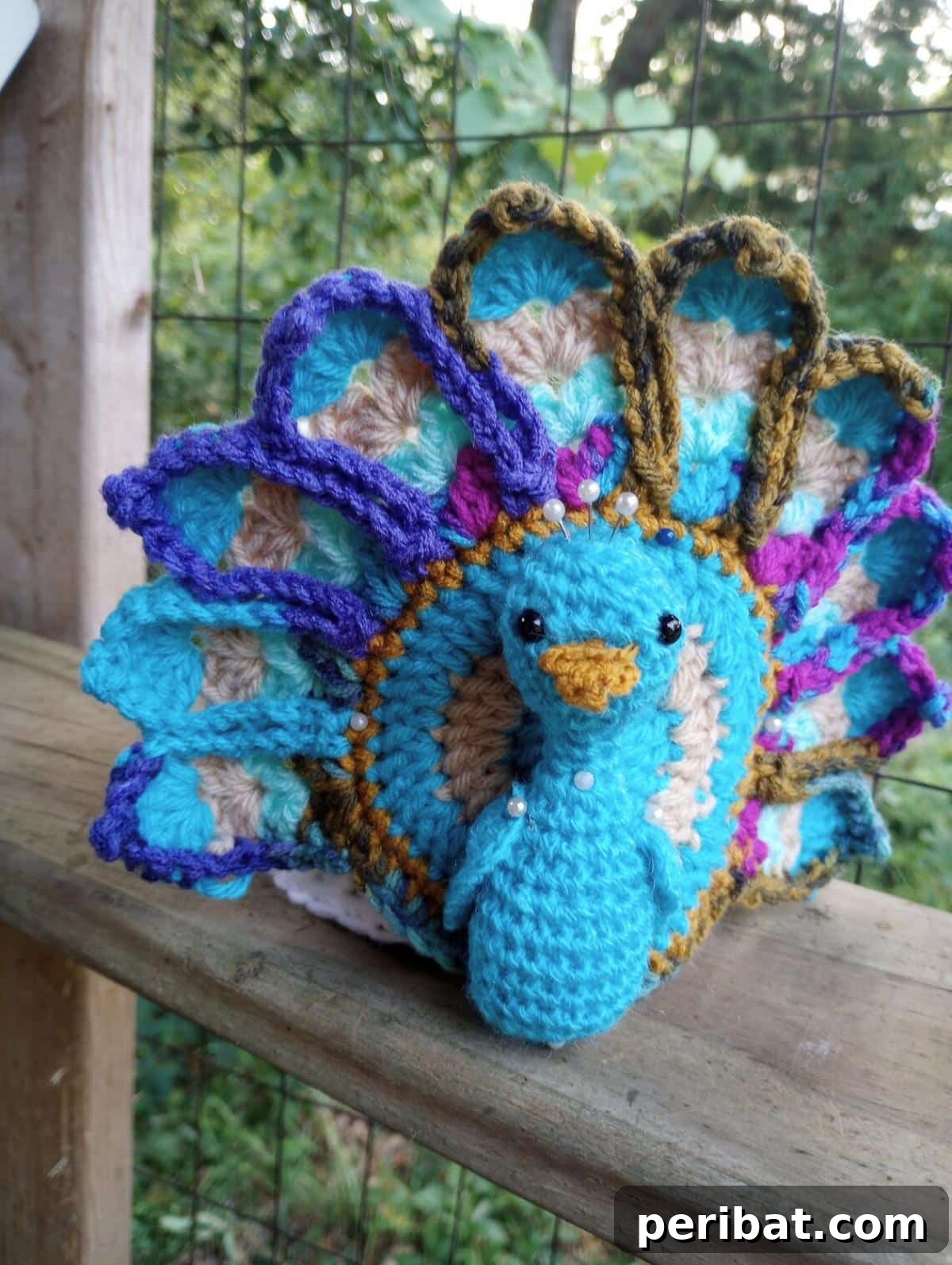 Peacock Toilet Paper Covers Crochet, featuring vibrant blue and green colors.