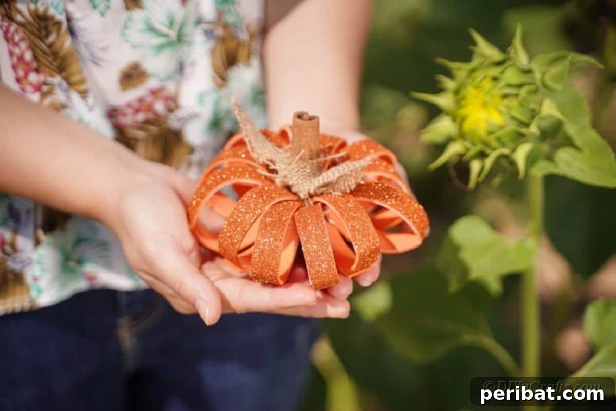 Recycled Toilet Paper Roll Pumpkin Decoration with cinnamon sticks