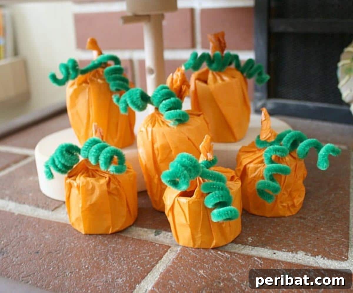 Cardboard Tube Pumpkin Craft for Kids, designed as treat holders.