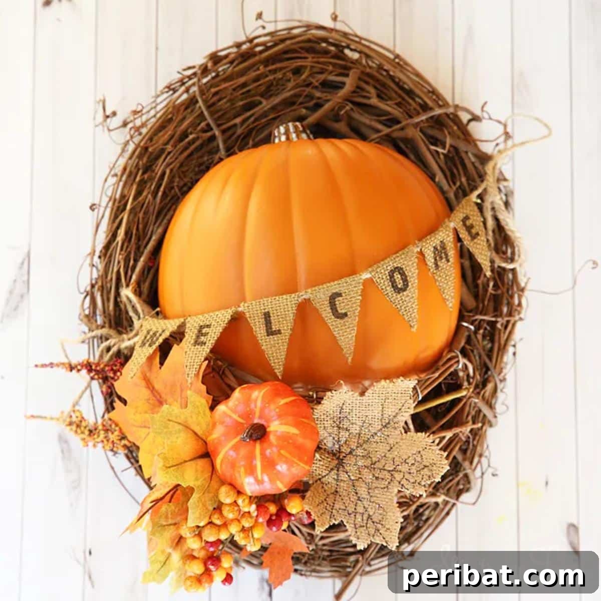 A unique DIY fall wreath featuring a rustic grapevine base adorned with a half pumpkin, colorful autumn leaves, and festive seasonal embellishments, perfect for a welcoming entryway.