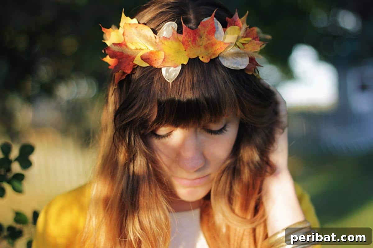 A beautifully crafted DIY leaf crown, made from real autumn leaves in vibrant colors, ideal for fall festivals, costumes, or whimsical photo shoots.