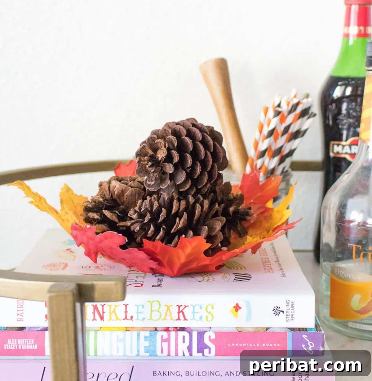 A unique and vibrant DIY leaf bowl crafted from colorful faux leaves and fabric stiffener, serving as an autumn-inspired centerpiece or decorative catch-all.