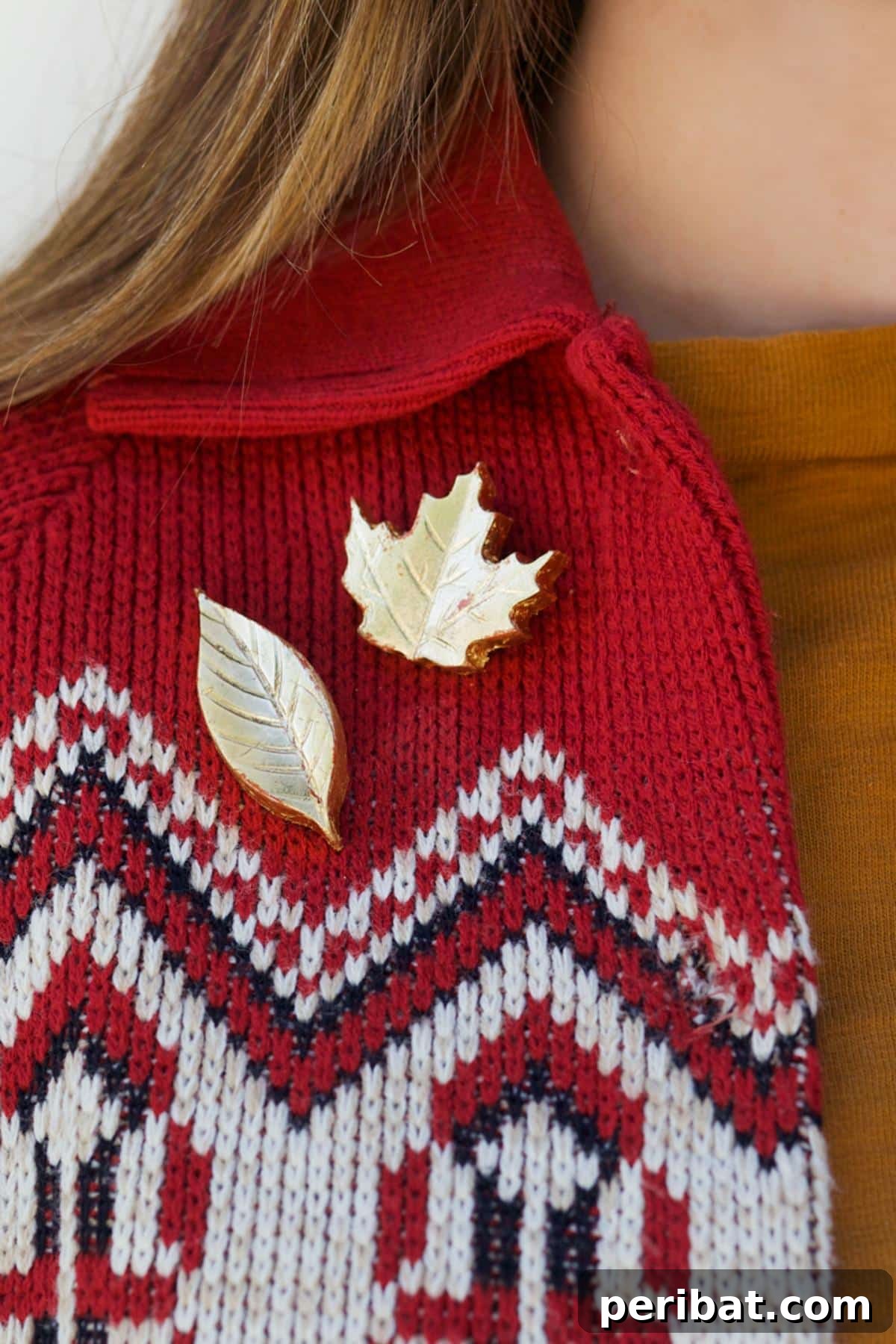 Elegant gold leaf brooches for fall, crafted from polymer clay and adorned with shimmering gold leaf, adding a chic autumnal touch to any outfit.