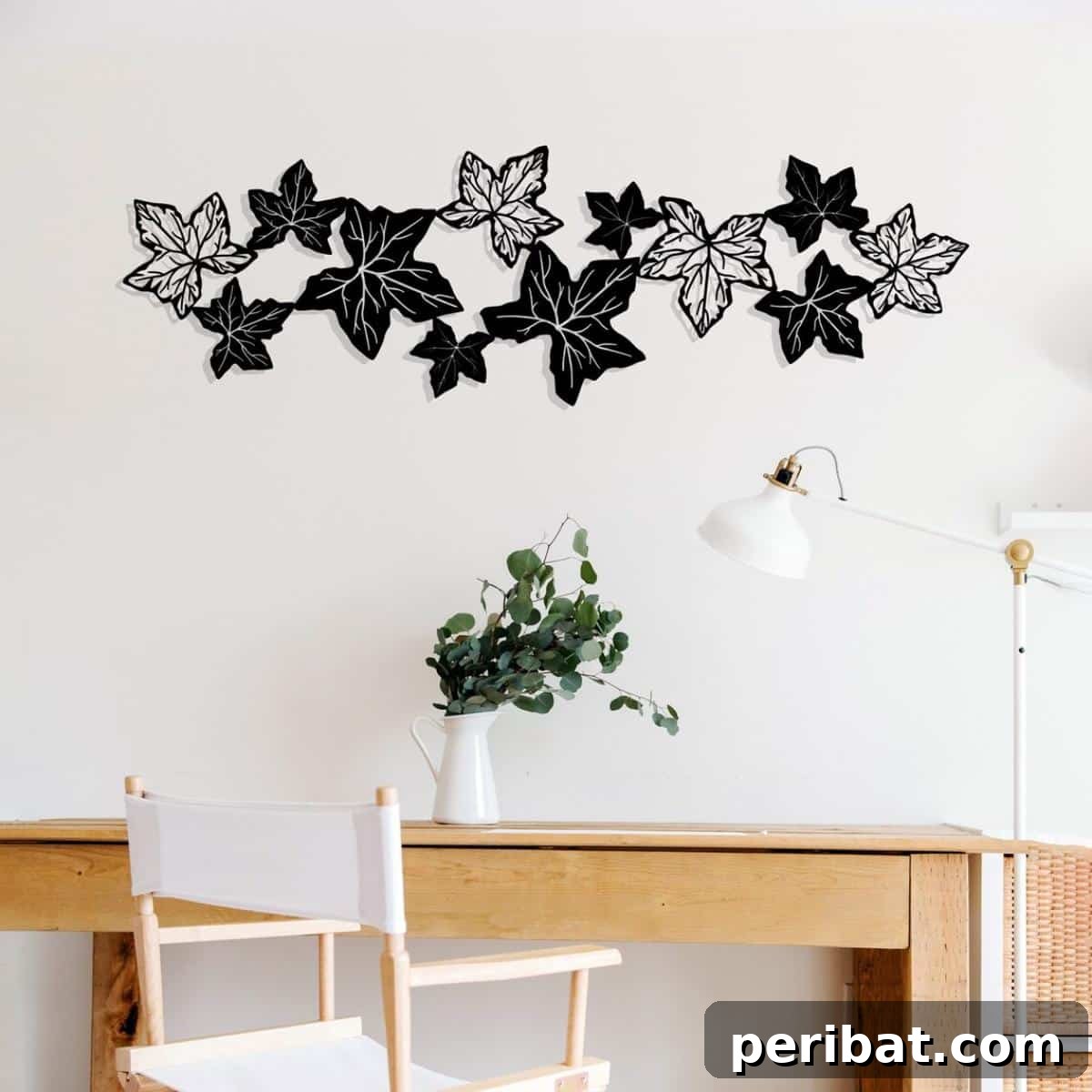A sophisticated large metal wall decor piece featuring intricately crafted ivy leaves, offering an elegant and permanent touch of nature's beauty as interior metal art.